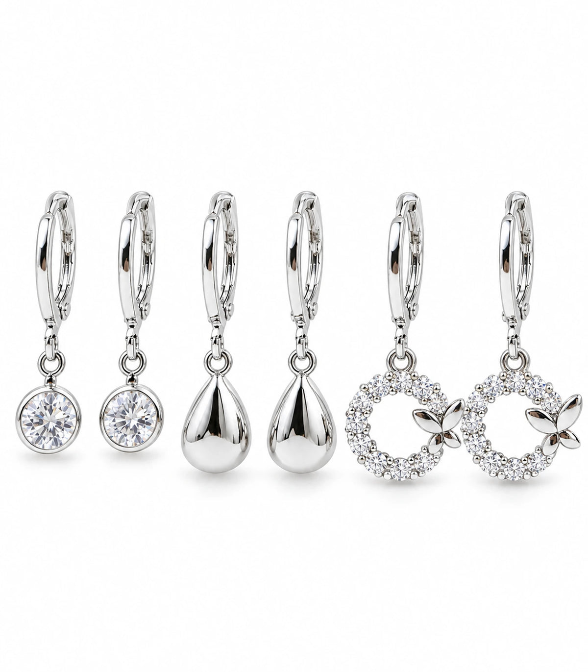 Complete silver-tone earring set: three pairs with clear round crystals, puffed teardrops and four-leaf crystal wreaths