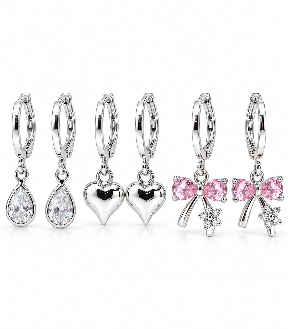 Complete six-earring silver-tone set: clear teardrop crystal, polished heart and pink bow charm hoop pairs on white