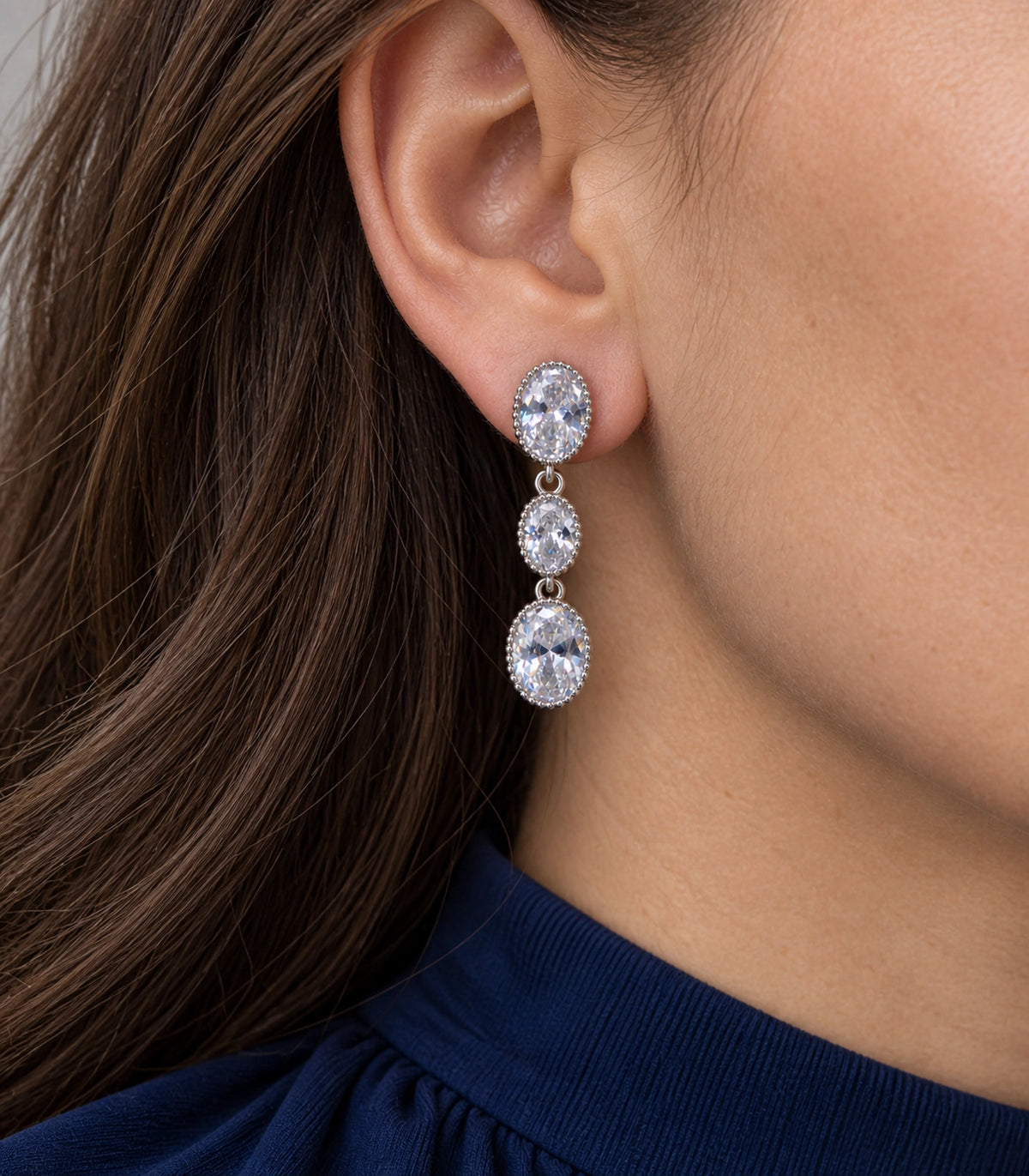 JIMIKI Triple Oval Crystal Drop Earrings in Silver tone, close-up detail #color_silver tone