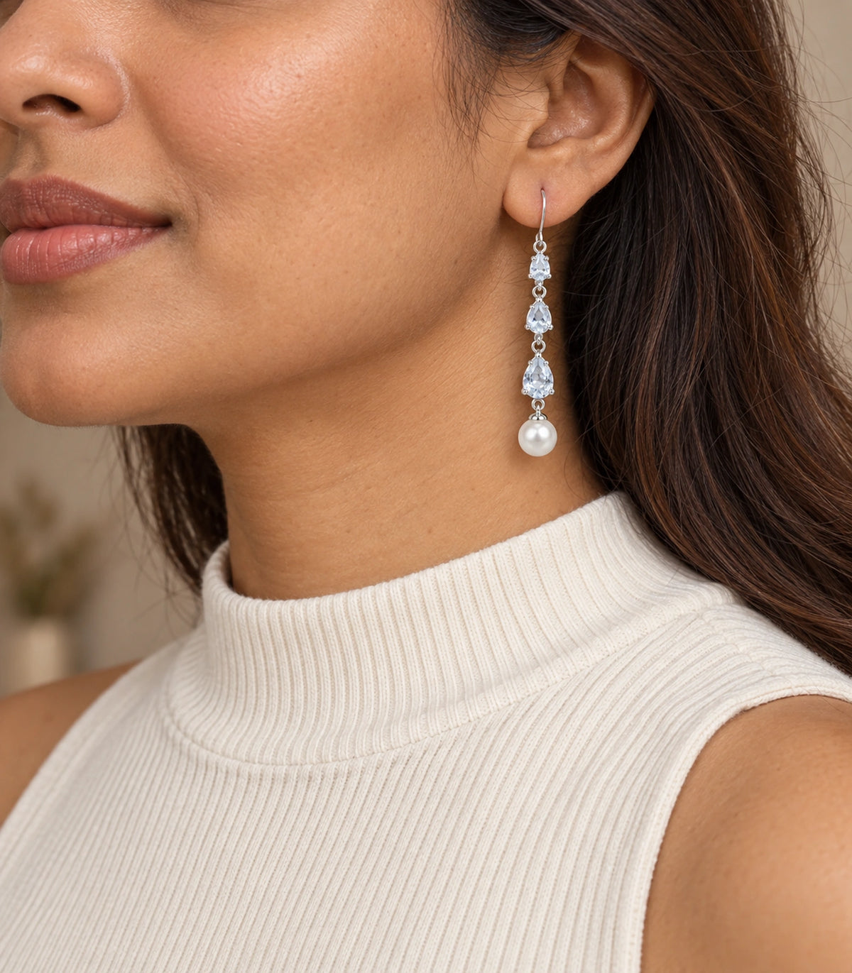 JIMIKI Silver-Tone Triple Pear Crystal Pearl Drop Earrings in Silver Tone, editorial model view