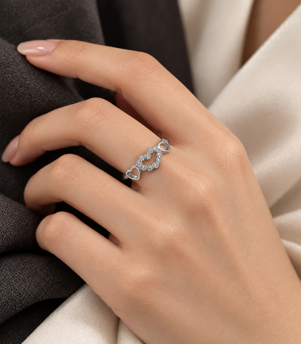 JIMIKI Triple Heart Crystal Adjustable Ring in Silver - editorial worn view #color_silver