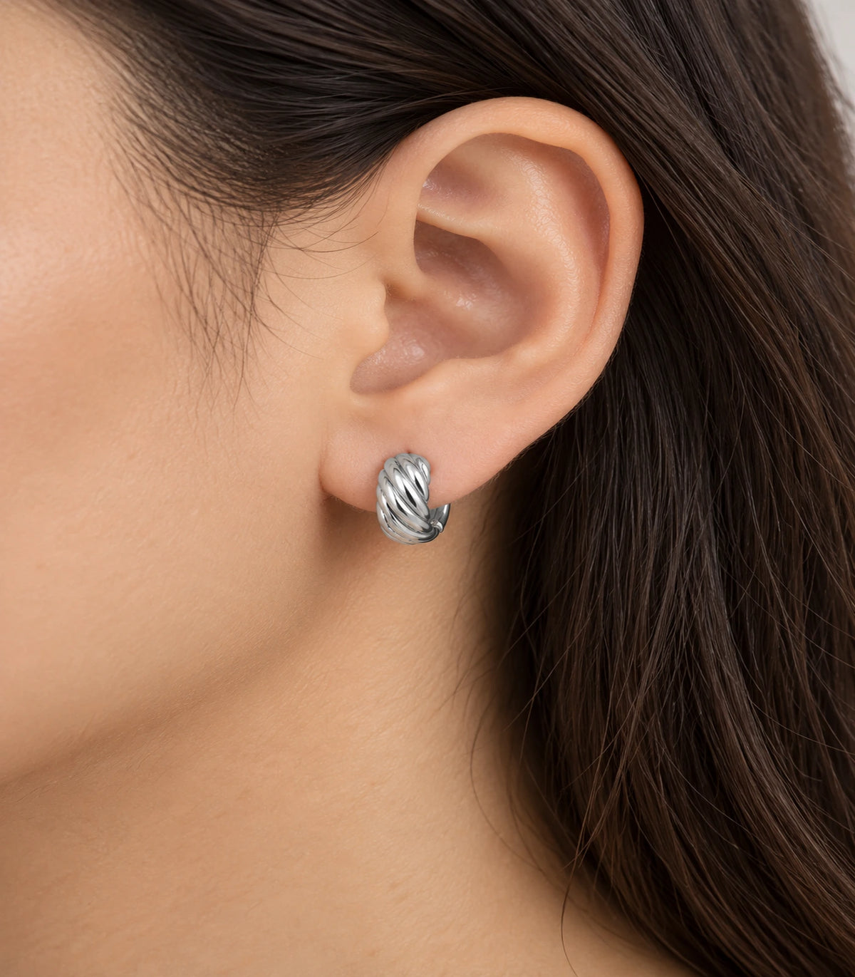 JIMIKI Twisted Rope Huggie Earrings in Silver — worn close-up detail #color_silver