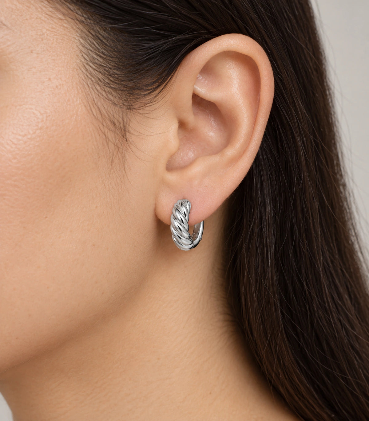 JIMIKI Twisted Rope Huggie Earrings in Silver — worn styling view #color_silver