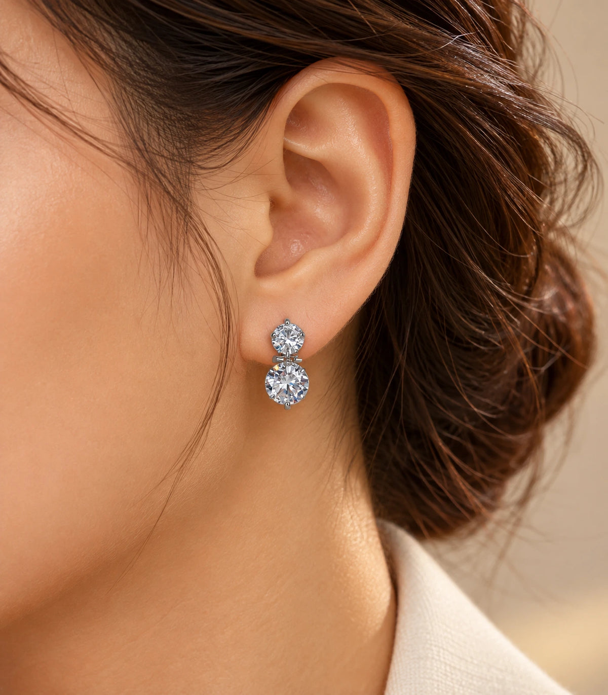 JIMIKI silver-tone two-round crystal drop earrings — editorial-model view