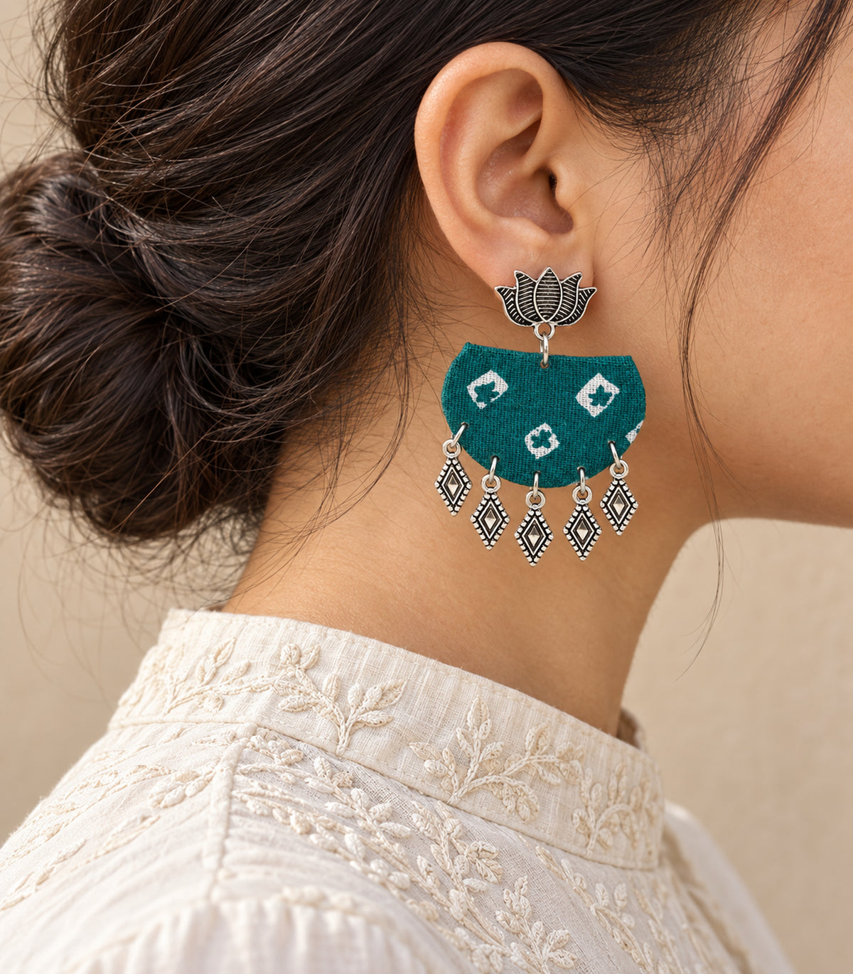 Teal fabric lotus diamond charm earrings - editorial model view