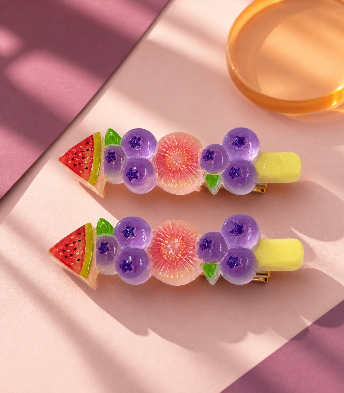 Watermelon Blueberry Citrus Barrette Pair in an editorial flat lay