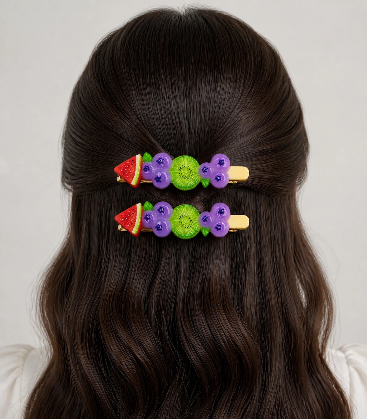 Model wearing the Watermelon Blueberry Kiwi Barrette Pair