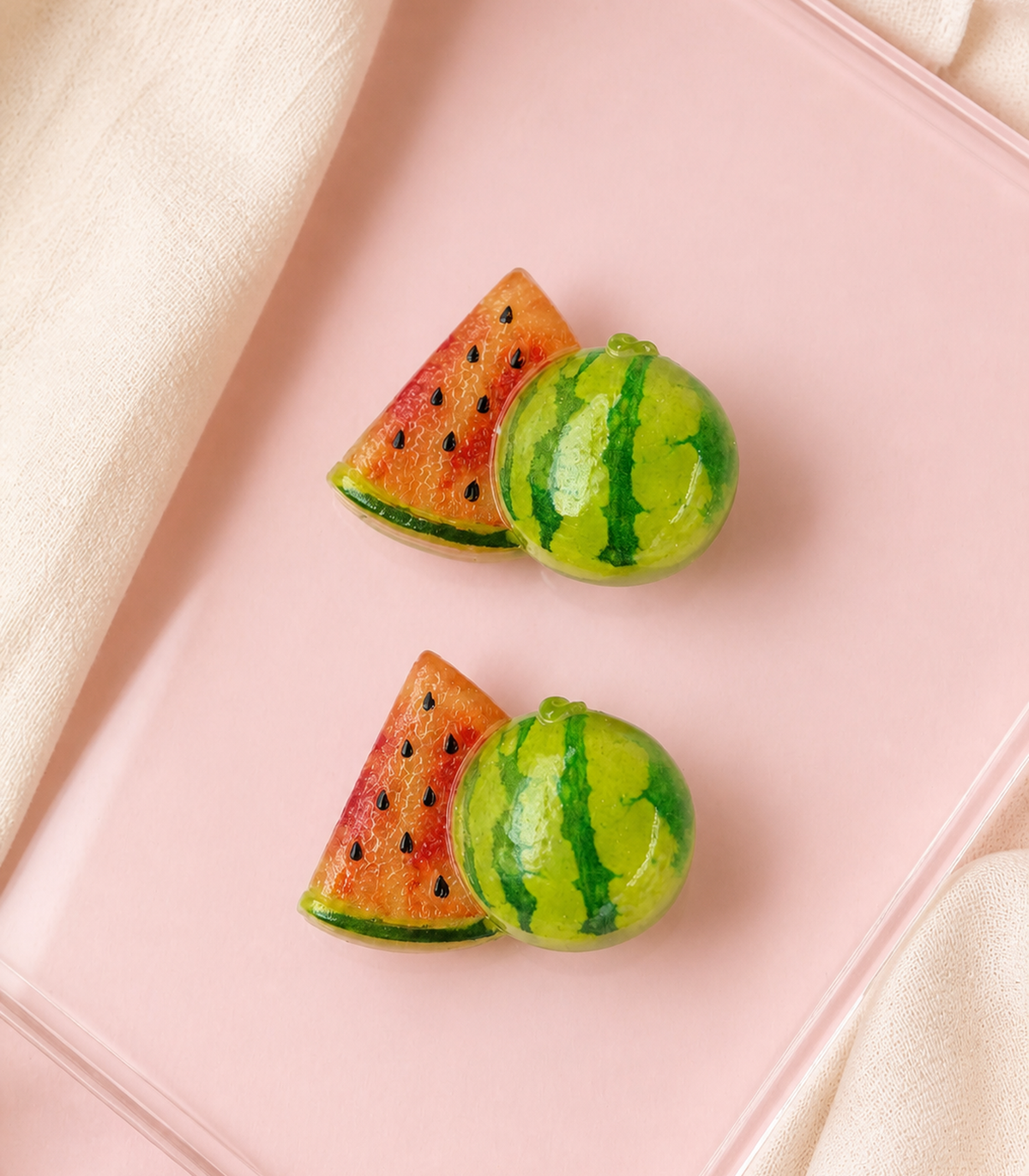 Watermelon Slice Barrette Pair editorial flat lay