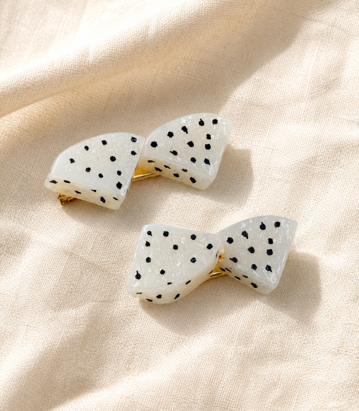 White Dragonfruit Double Wedge Clip Pair in an editorial flat lay