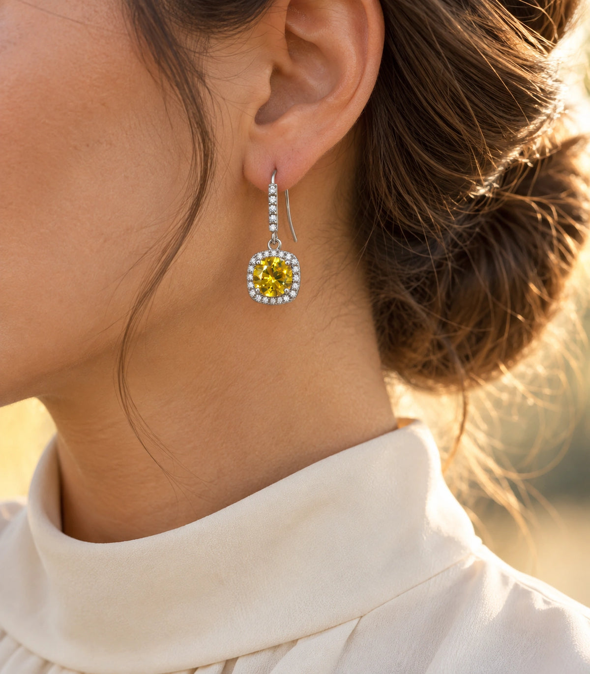 JIMIKI Crystal Cushion Halo Hook Earring Pair in Silver tone / yellow, editorial model view #color_silver tone / yellow