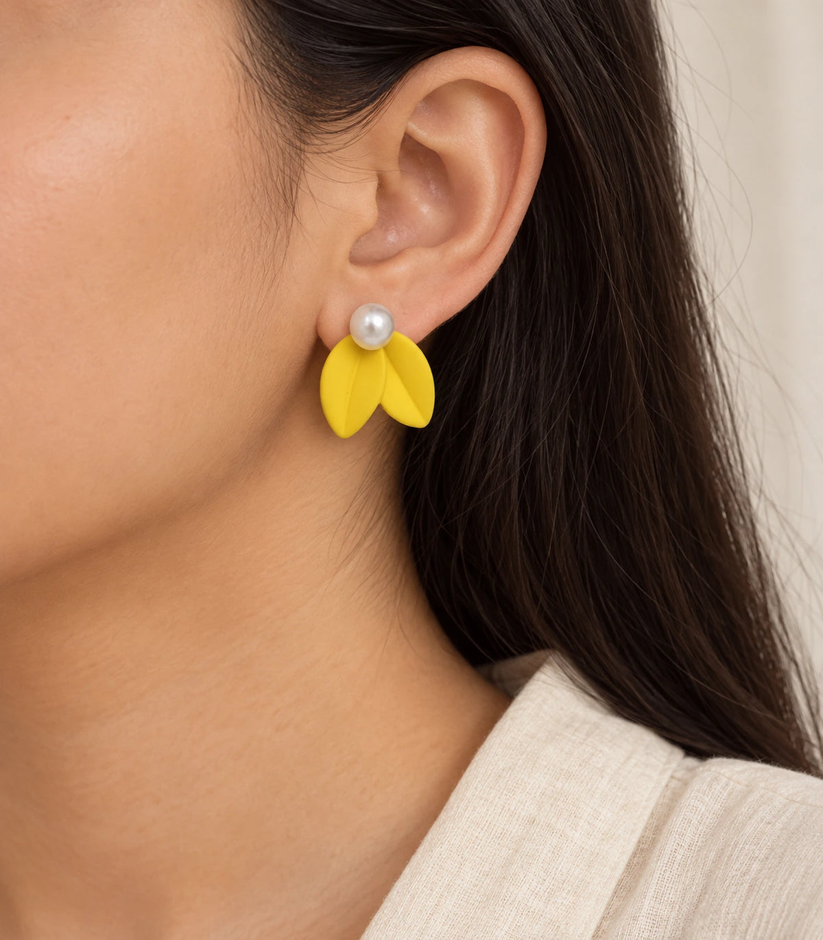 JIMIKI Double Leaf Pearl Stud Earrings in Yellow — earrings worn on the ear #color_yellow