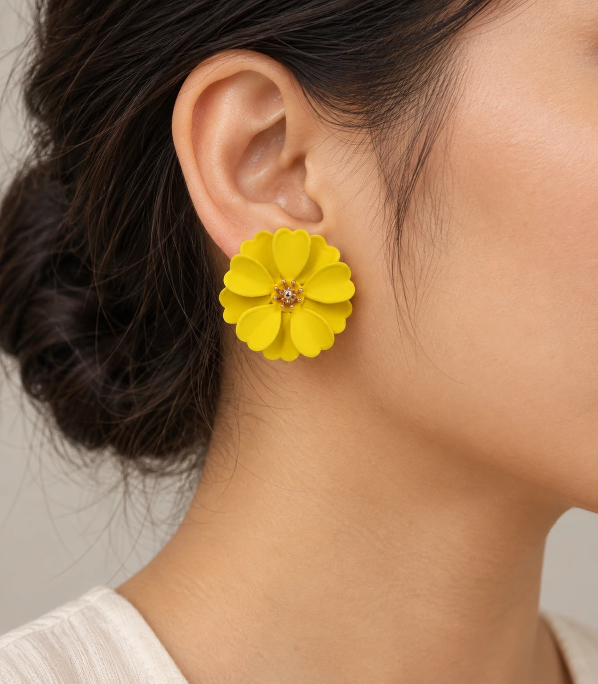 JIMIKI Yellow Layered Daisy Stud Earrings - earring worn on model #color_yellow