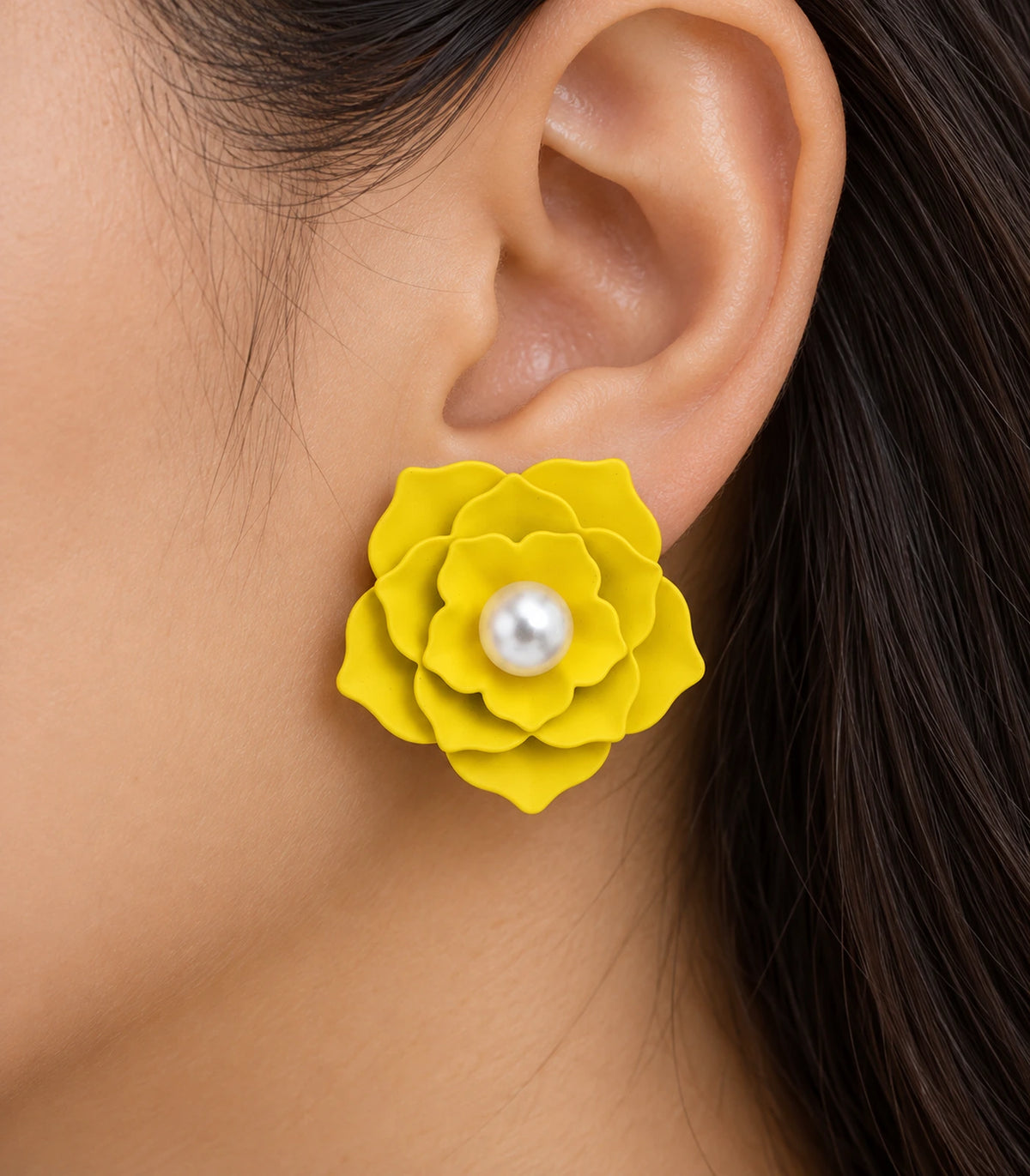JIMIKI Layered Flower Pearl Stud Earrings, Yellow — worn close-up showing petal detail #color_yellow