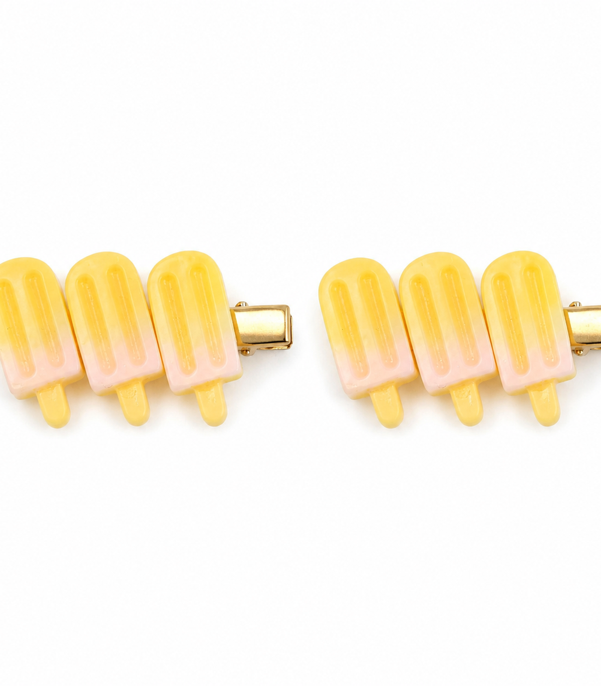 Yellow Popsicle Trio Clip Pair on a white background