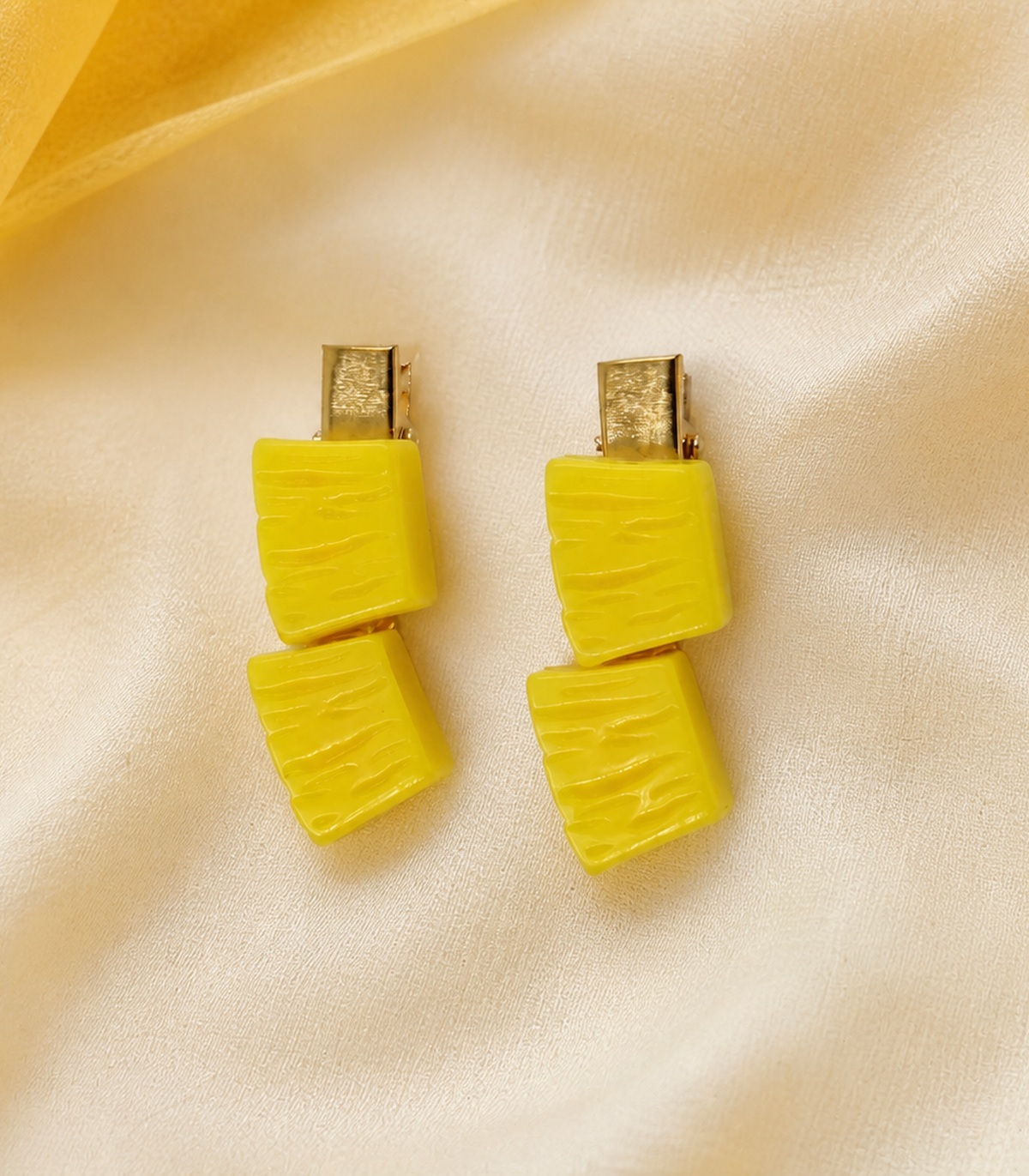 Yellow Wavy Duo Clip Pair in an editorial flat lay