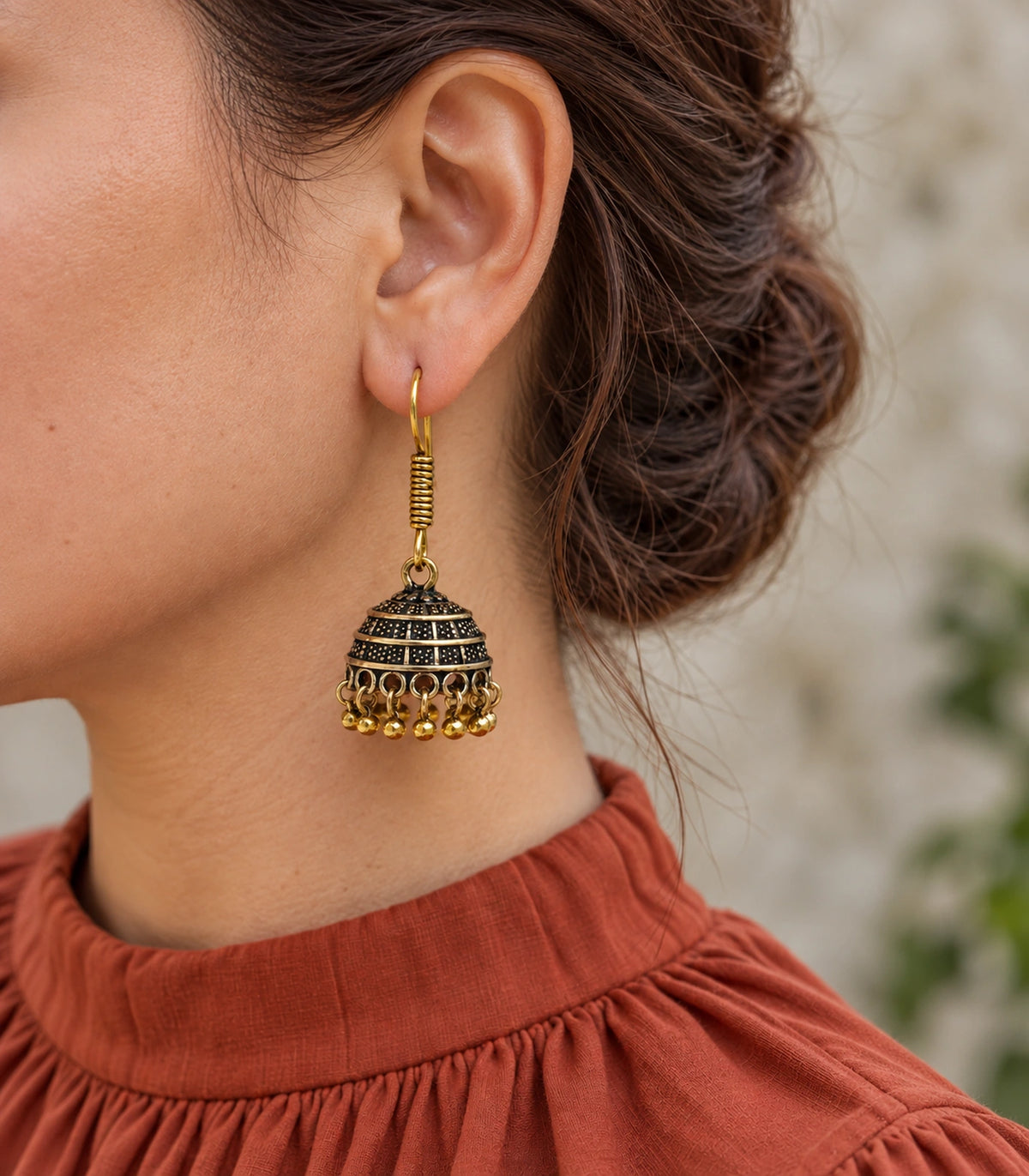 JIMIKI Antique Gold Banded Dotted Hook Jhumka Earrings in Antique Gold - editorial worn view #color_antique-gold