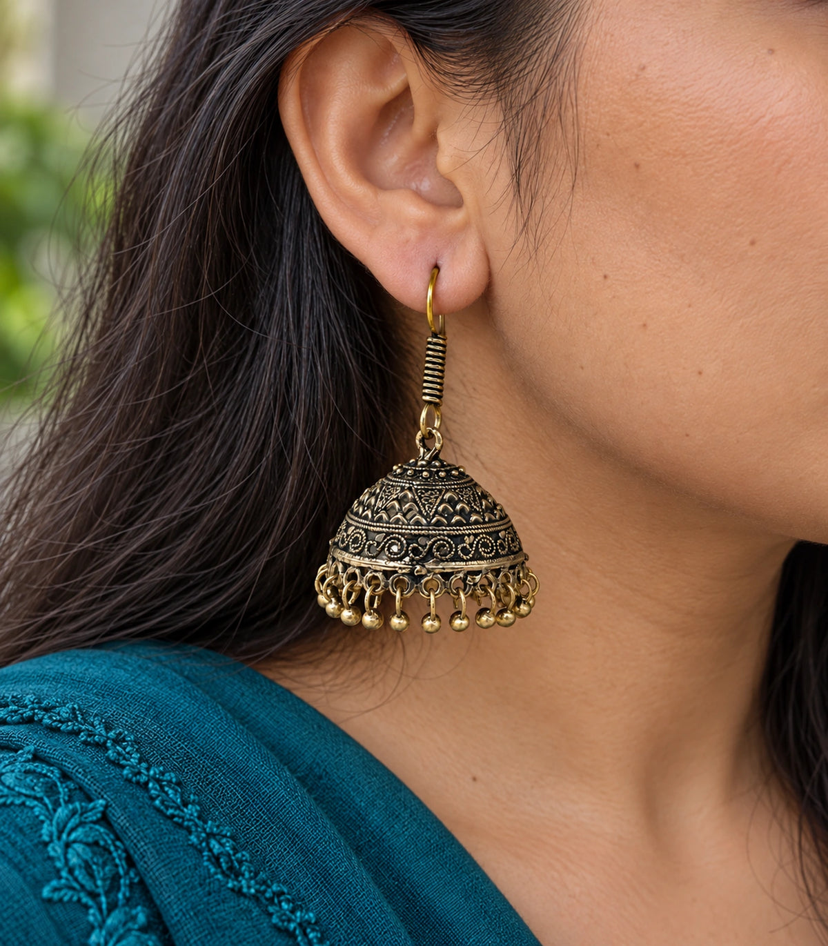 JIMIKI Antique Gold Chevron Scroll Jhumka Earrings - Antique Gold close-up of the earring worn #color_antique-gold
