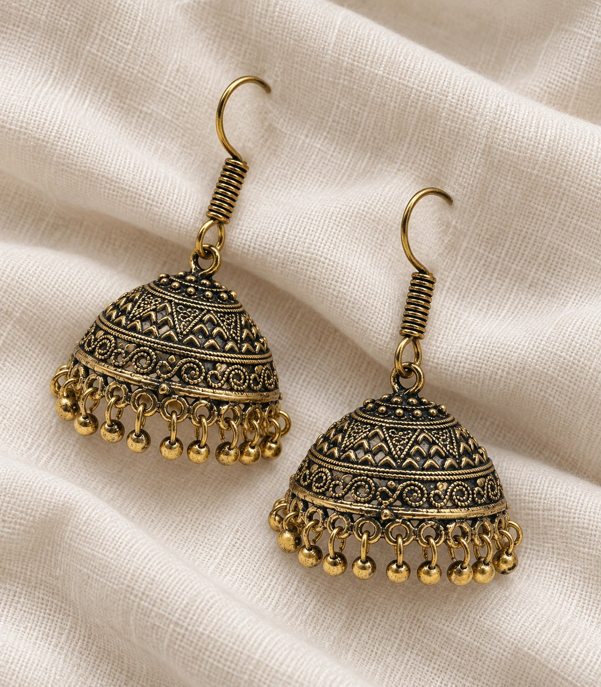 JIMIKI Antique Gold Chevron Scroll Jhumka Earrings - Antique Gold styled flatlay of the matching earrings #color_antique-gold