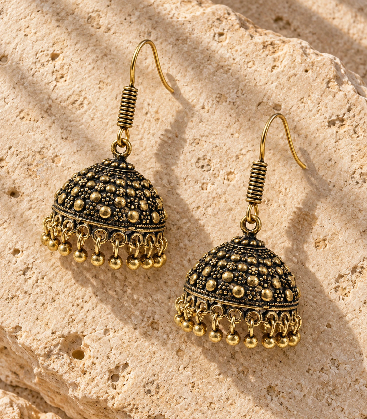 JIMIKI Antique Gold Dotted Dome Hook Jhumka Earrings in Antique Gold - editorial flatlay #color_antique-gold