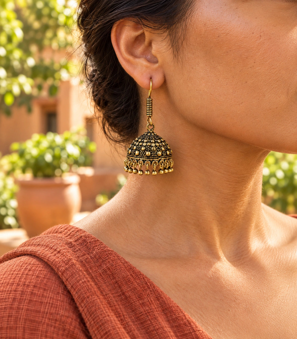 JIMIKI Antique Gold Dotted Dome Hook Jhumka Earrings in Antique Gold - editorial worn view #color_antique-gold