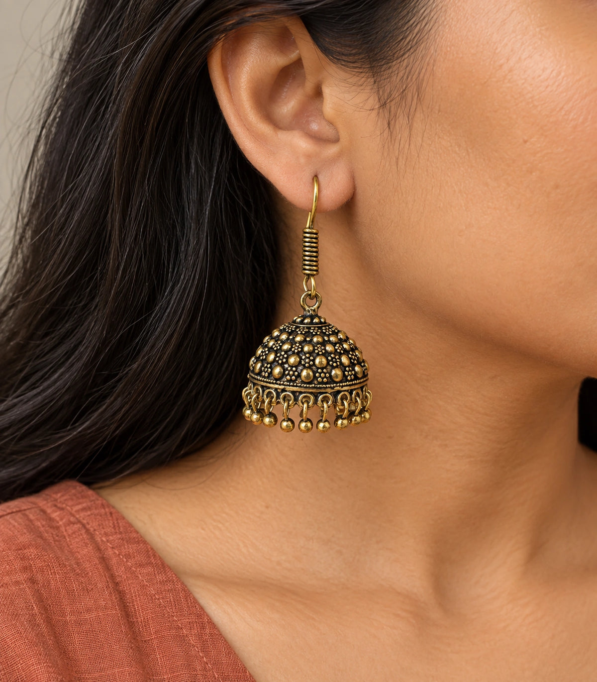 JIMIKI Antique Gold Dotted Dome Hook Jhumka Earrings in Antique Gold - worn styling view #color_antique-gold