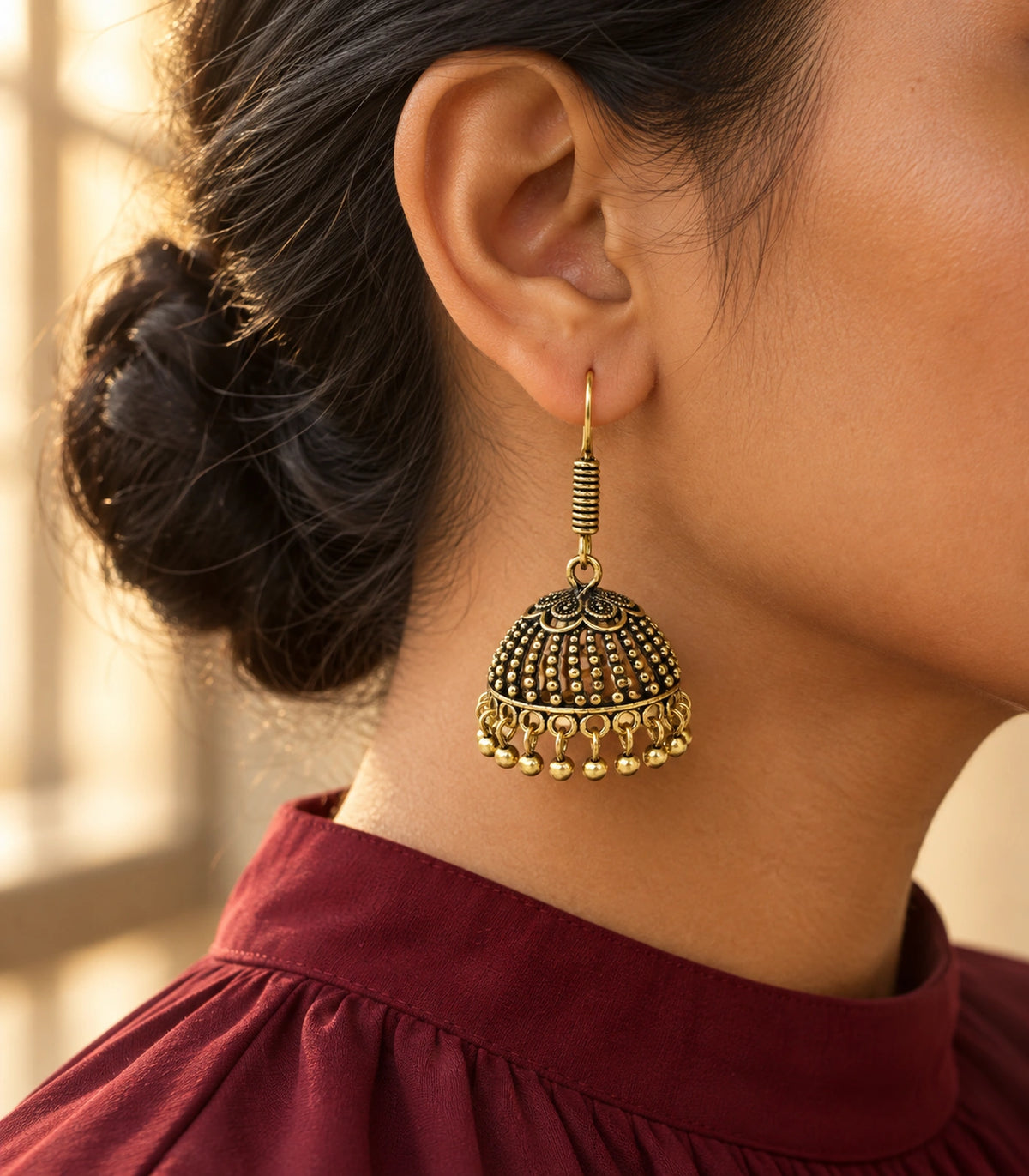 JIMIKI Antique Gold Floral Cap Beaded Dome Jhumka Earrings - styled model wearing the earring #color_antique-gold