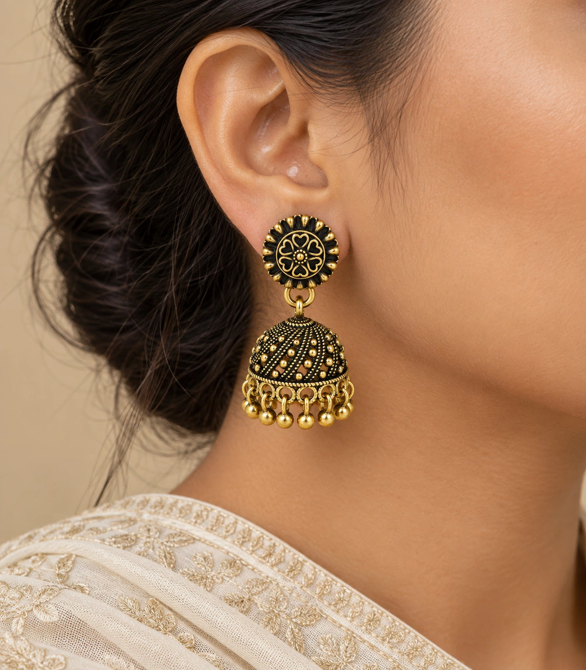 JIMIKI Antique Gold Floral Rosette Jhumka Earrings - Earring worn with a cream embroidered outfit #color_antique-gold