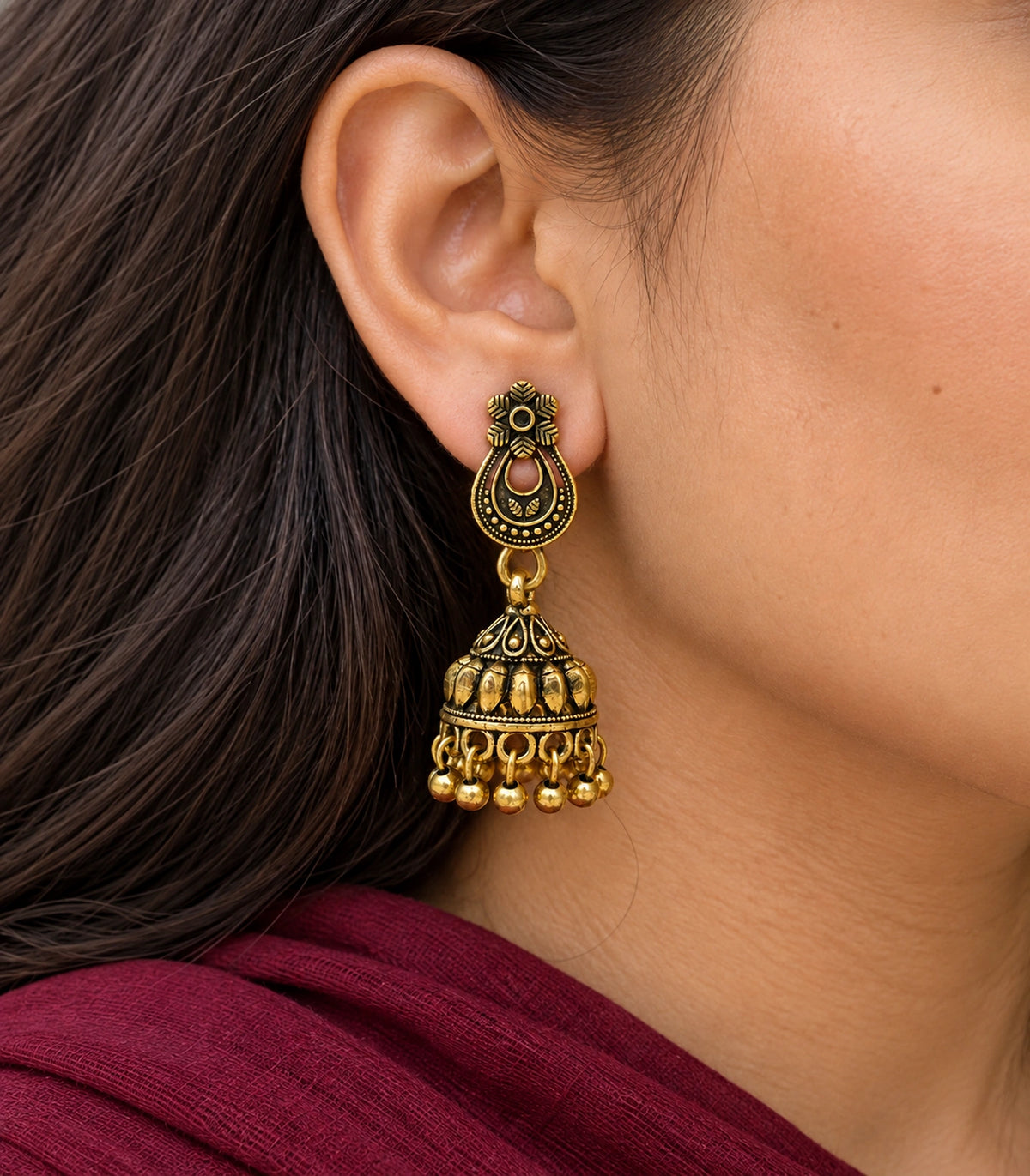 JIMIKI Antique Gold Floral Teardrop Leaf Jhumka Earrings in Antique Gold - close-up details #color_antique-gold