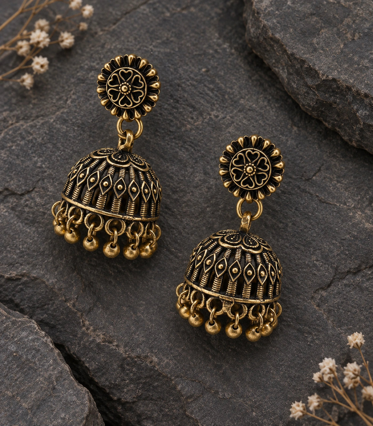JIMIKI Antique Gold Heart Flower Openwork Jhumka Earrings in Antique Gold - editorial flatlay #color_antique-gold