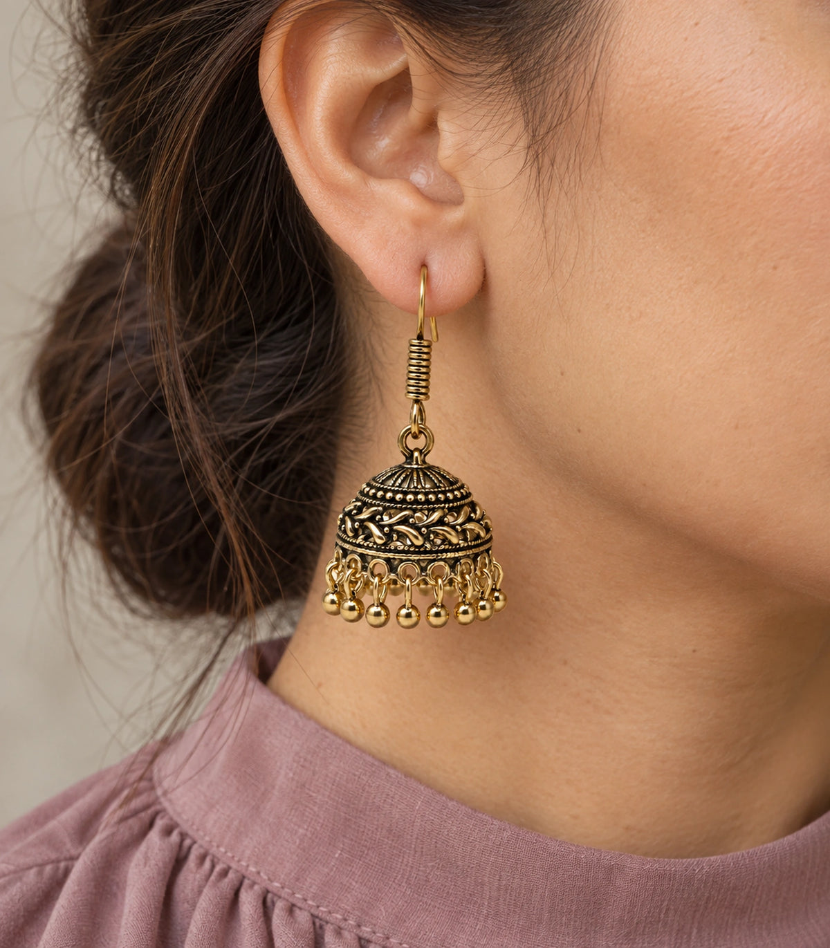 JIMIKI Antique Gold Leaf Scroll Dome Hook Jhumka Earrings - Worn styling view #color_antique-gold