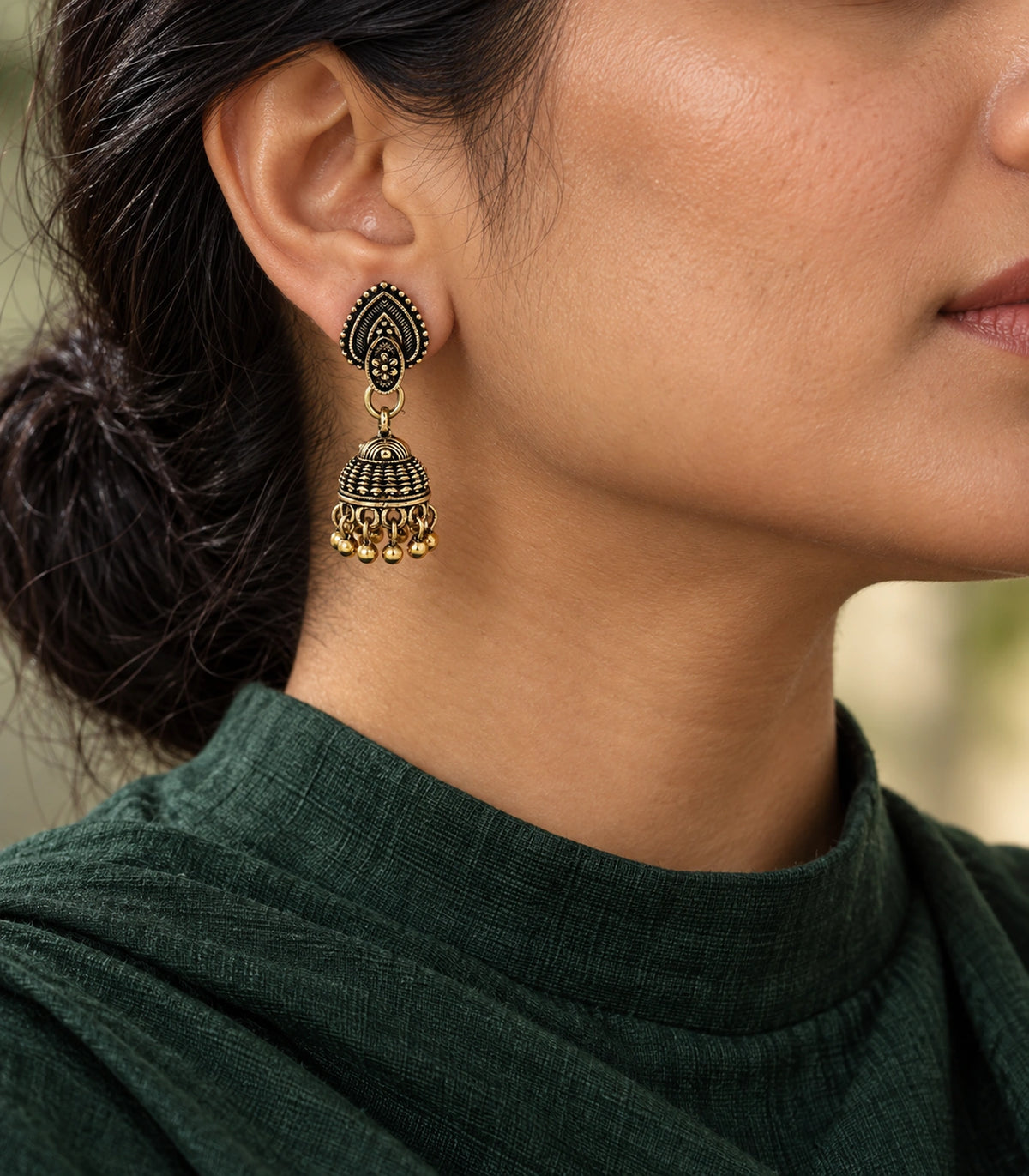 JIMIKI Leaf Stud Beaded Jhumka Earrings - Antique Gold styled model wearing the earring #color_antique-gold