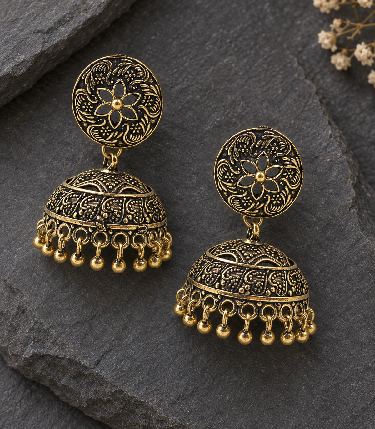JIMIKI Antique Gold Open Flower Paisley Jhumka Earrings in Antique Gold - editorial flatlay #color_antique-gold
