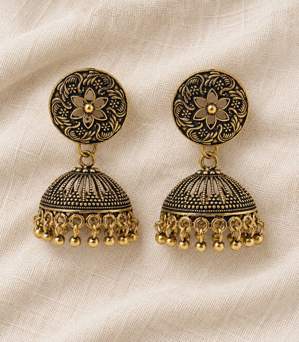 JIMIKI Antique Gold Open Flower Ribbed Jhumka Earrings in Antique Gold - editorial flatlay #color_antique-gold