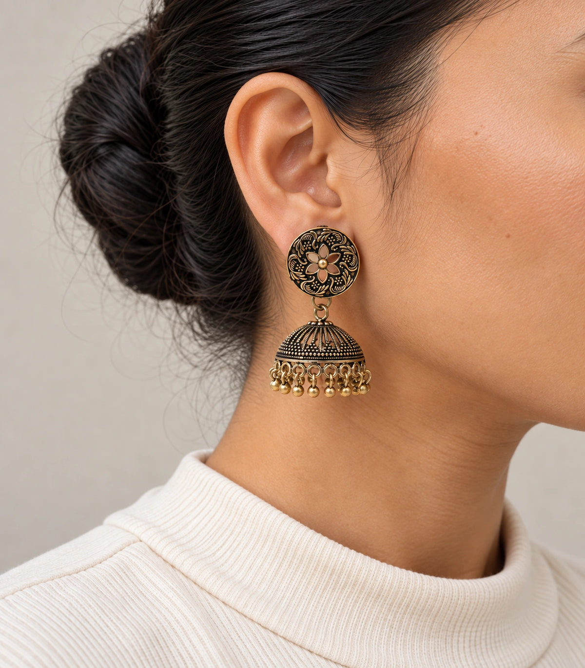 JIMIKI Antique Gold Open Flower Ribbed Jhumka Earrings in Antique Gold - worn styling view #color_antique-gold