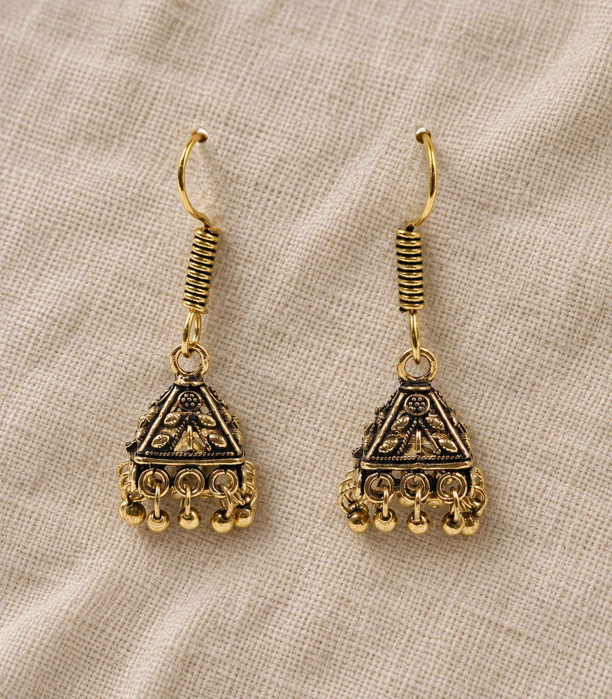 JIMIKI Pyramid Floral Hook Jhumka Earrings in Antique Gold - editorial flatlay #color_antique-gold