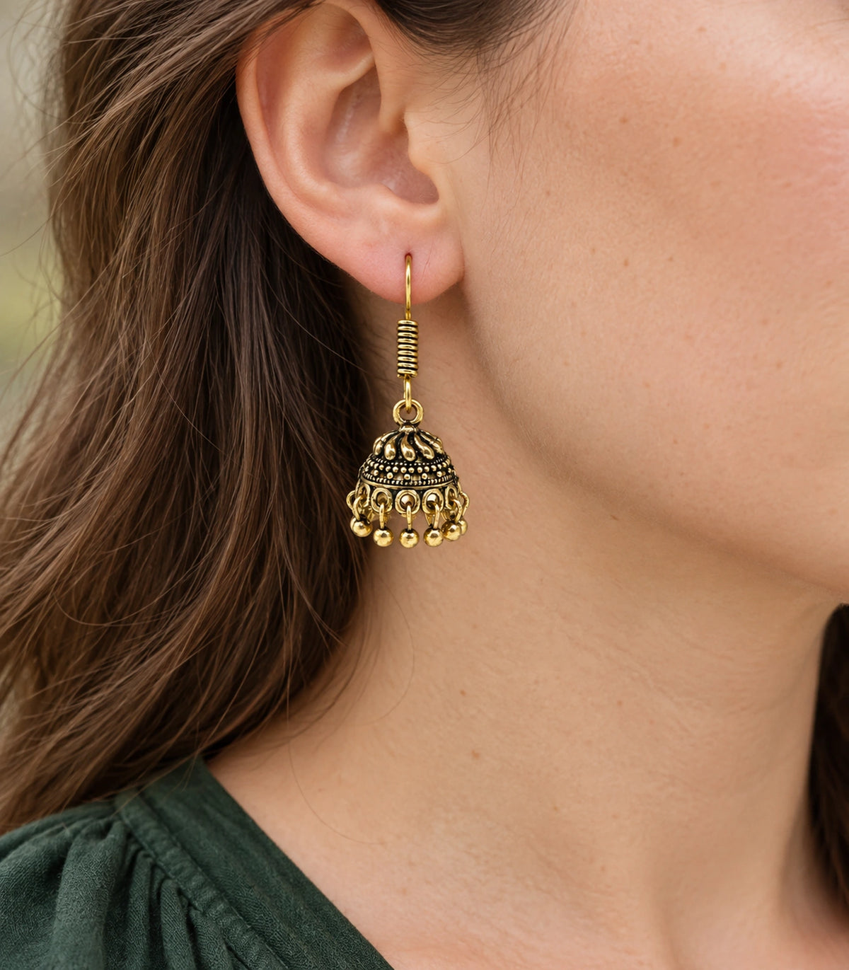 JIMIKI Antique Gold Swirl Crown Jhumka Earrings - earring worn with a clear view of the design #color_antique-gold