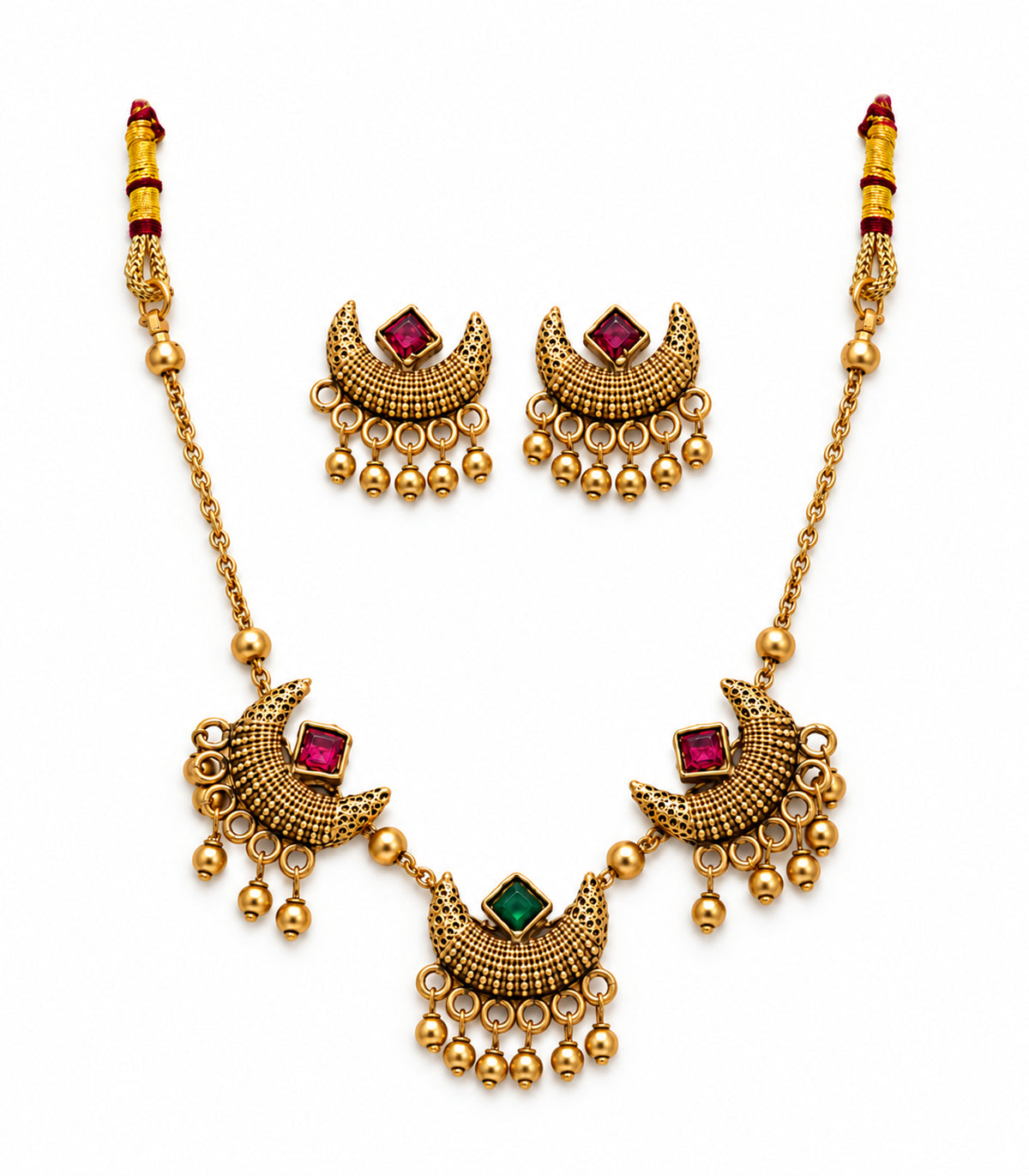 Antique gold-tone magenta and green square crescent necklace with two matching earrings on white