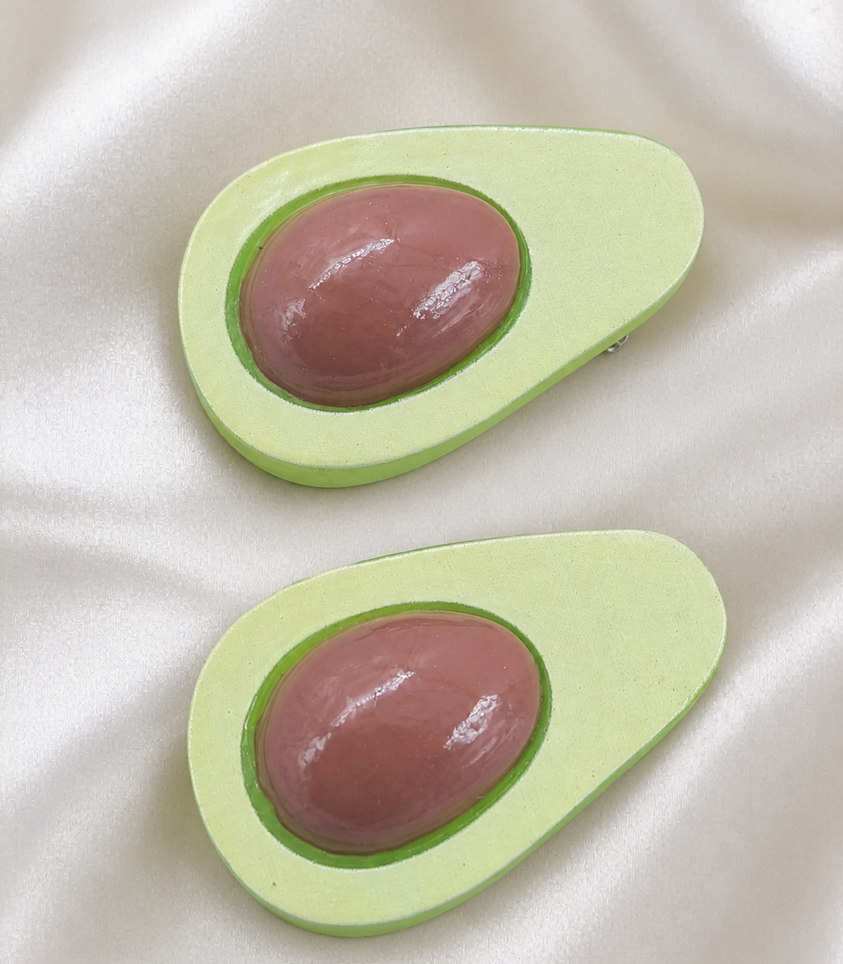 JIMIKI Elongated Avocado Slice Barrette Pair in Pale Green / Brown, close-up detail