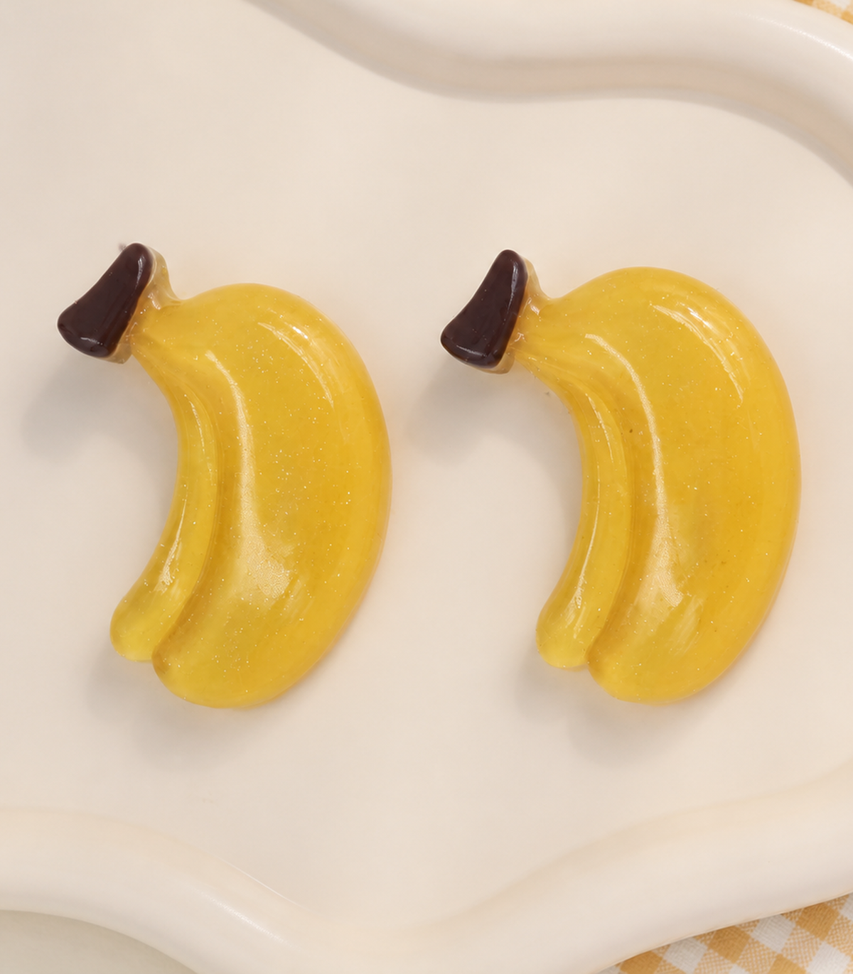 Banana Barrette Pair editorial flat lay
