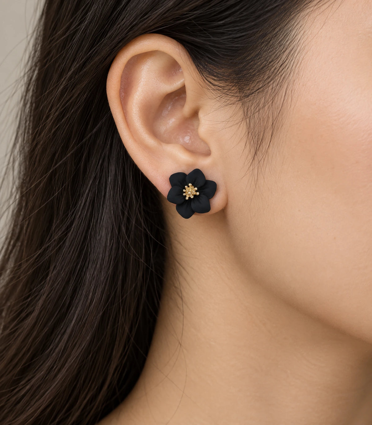 JIMIKI Black compact six petal flower stud earrings, flower stud worn at the ear #color_black