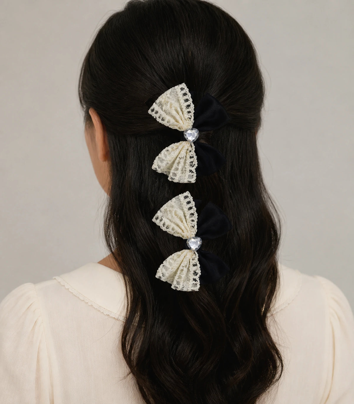 Model wearing the Black Ivory Lace Heart Bow Clip Pair