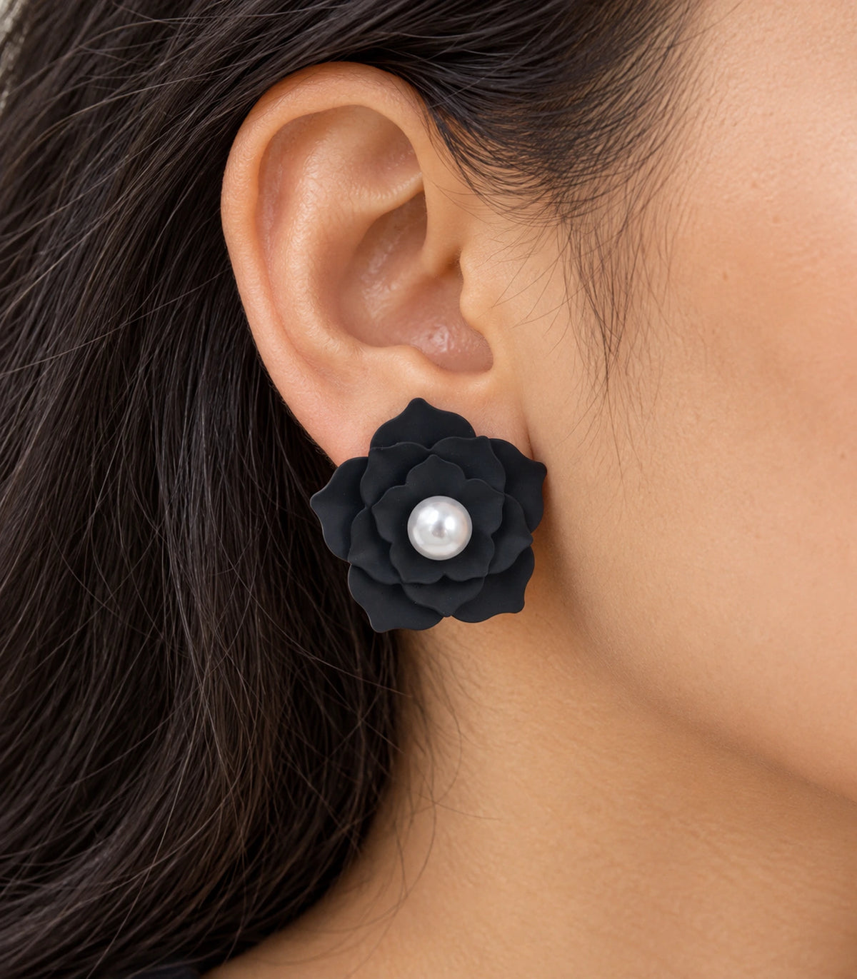 JIMIKI Layered Flower Pearl Stud Earrings, Black — worn close-up showing petal detail #color_black