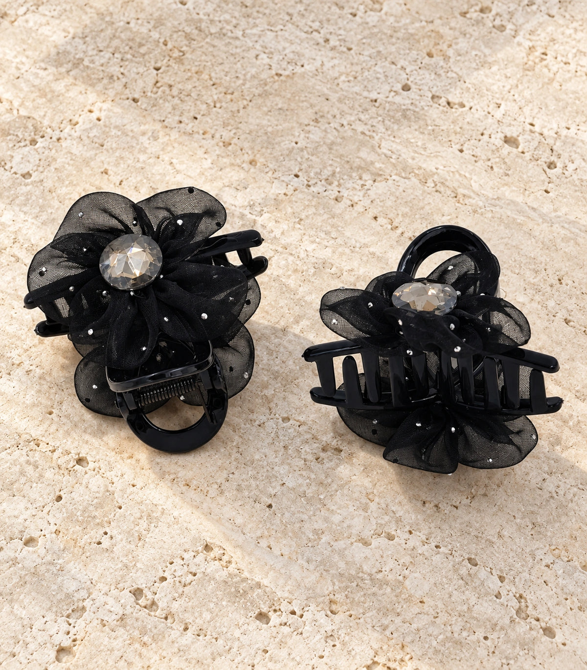 JIMIKI Organza Flower Crystal Hair Claw Clips in Black, editorial flat lay #color_black
