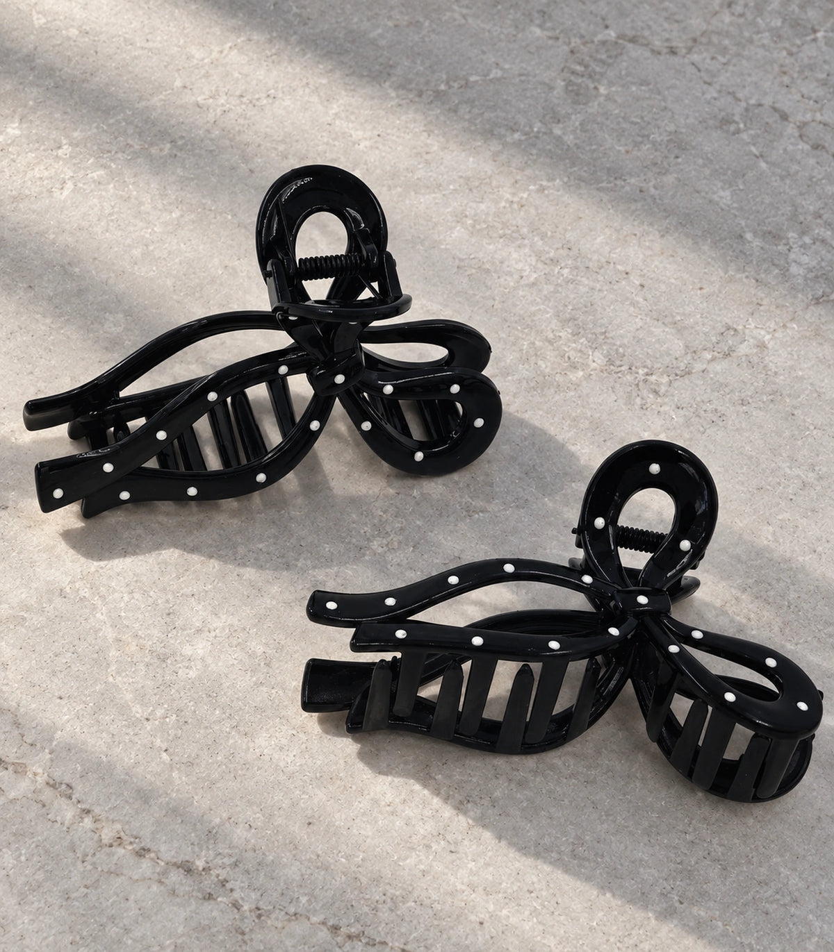 JIMIKI Polka Dot Openwork Bow Hair Claw Clips in Black / White, editorial flat lay #color_black / white