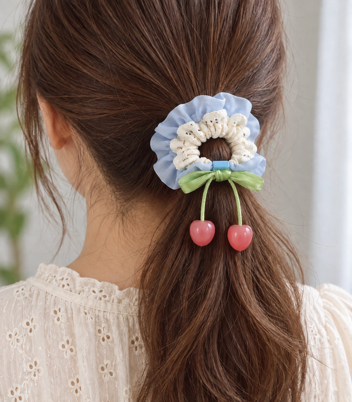 JIMIKI Lace Scrunchie With Cherry Charms in Blue, model wearing view #color_blue
