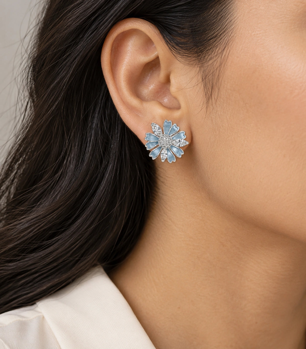 JIMIKI Petal Crystal Flower Stud Earring Pair in Blue / silver tone, model wearing view #color_blue / silver tone