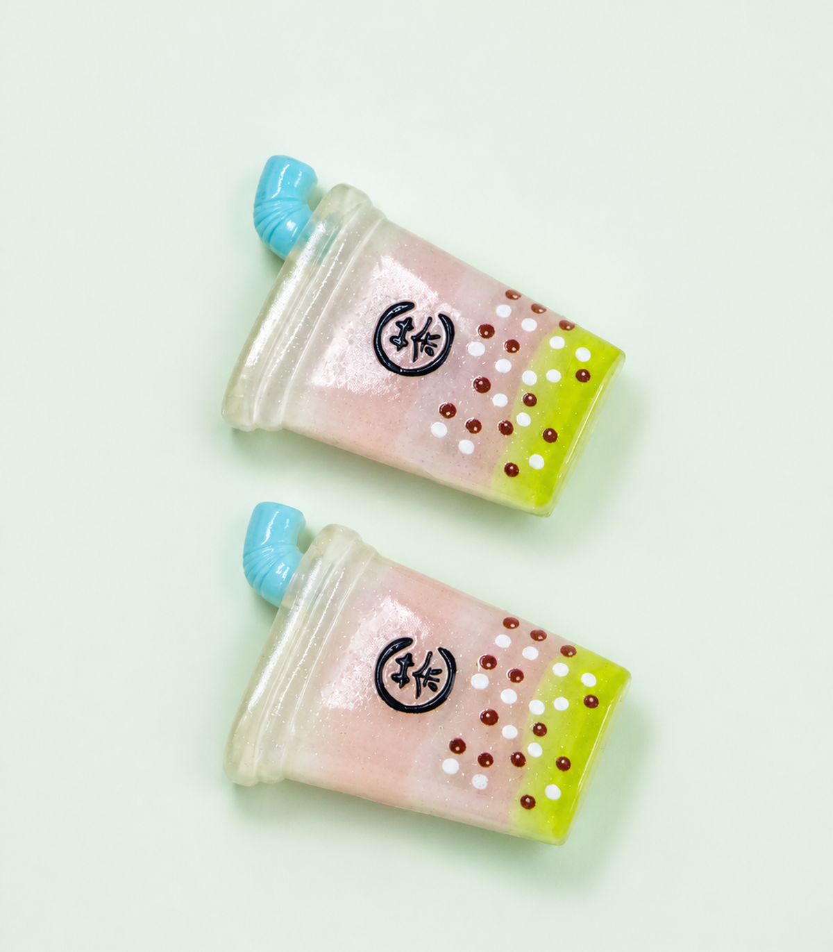 Blue Straw Drink Barrette Pair editorial flat lay