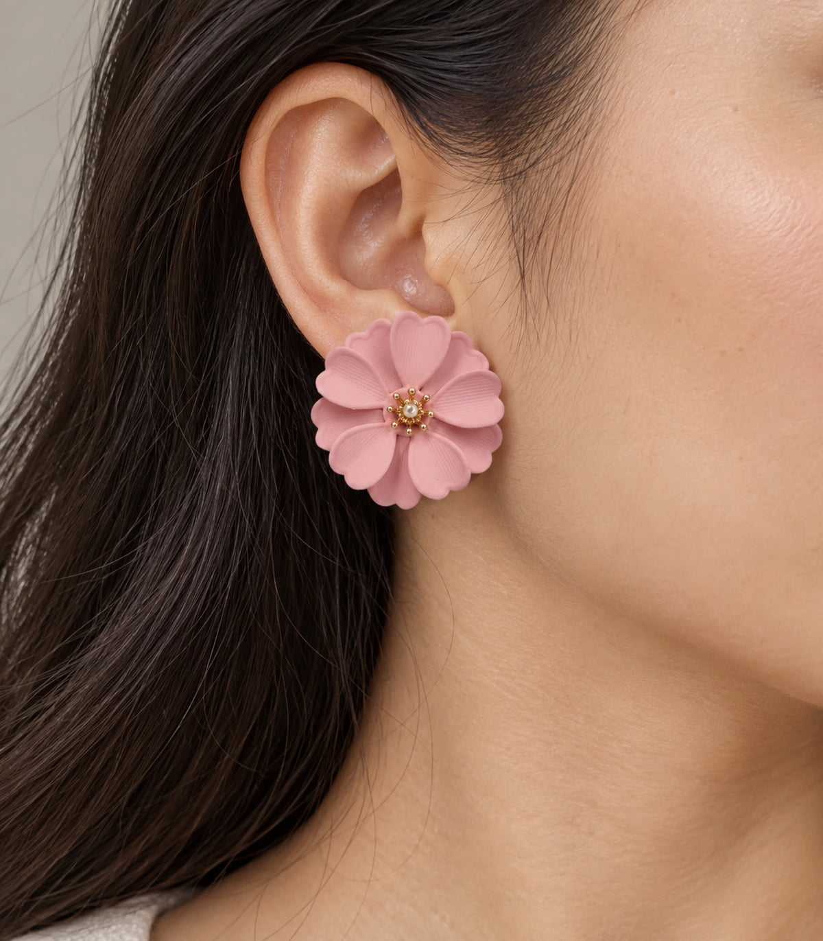 JIMIKI Blush Pink Layered Daisy Stud Earrings - earring worn on model #color_blush pink