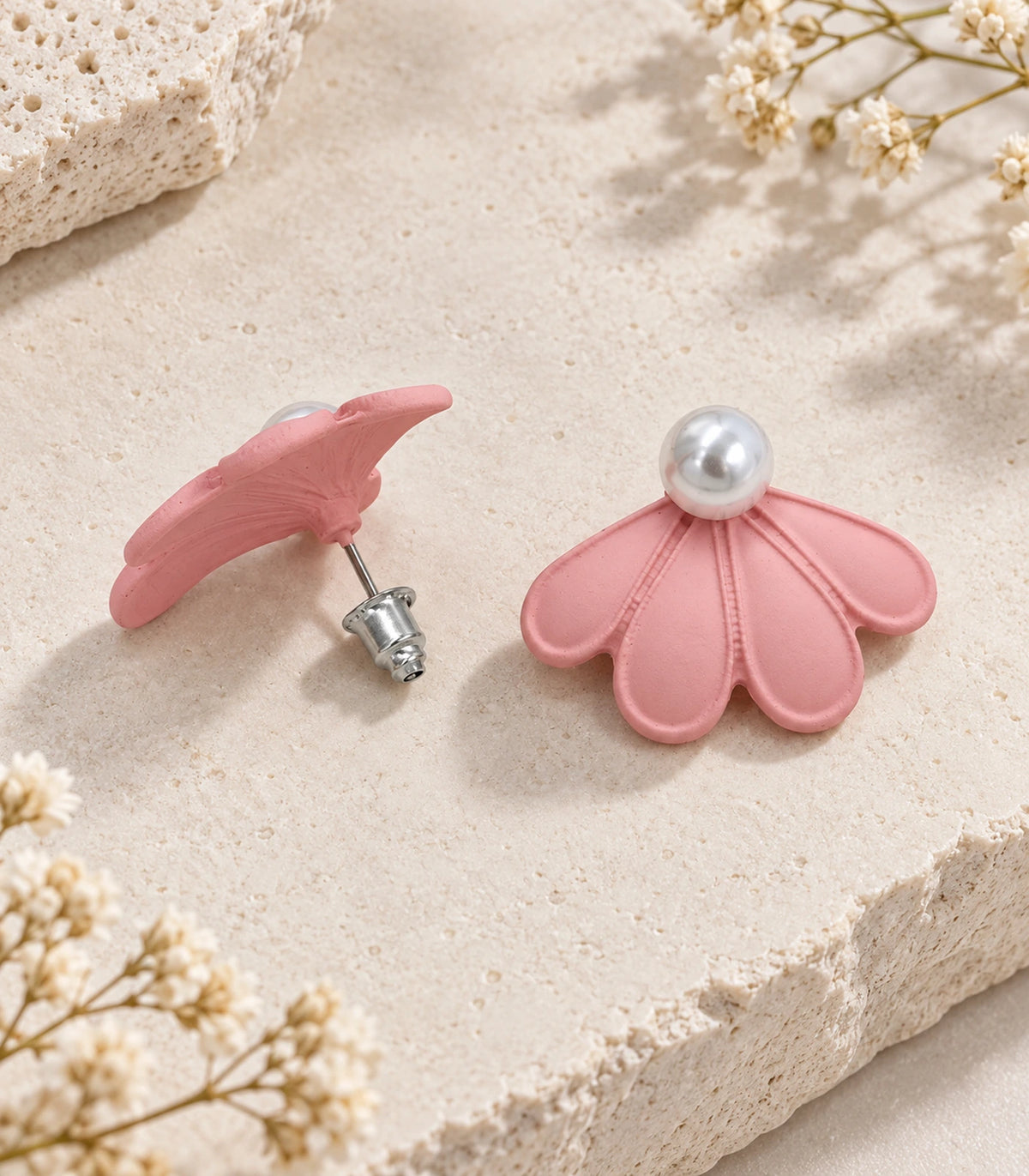 JIMIKI Blush Pink pearl fan petal stud earrings, pair in an editorial flat lay #color_blush pink