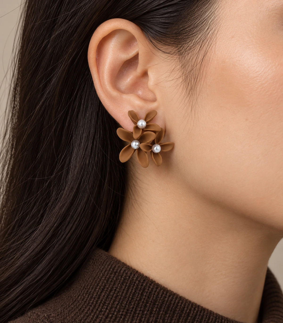 JIMIKI Camel cascading floral cluster stud earrings, worn on the ear with the floral cluster visible #color_camel